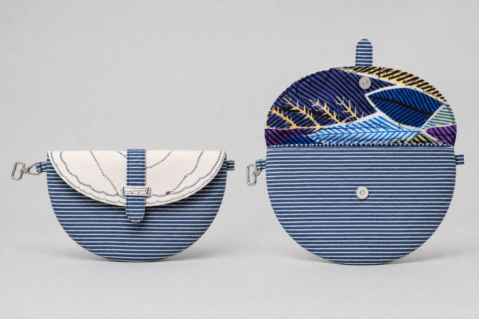 Half-moon crossbody bag with African print lining
